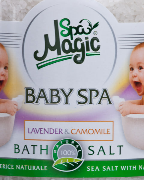 Close-up of the white Baby SPA label: two laughing babies in baby baths