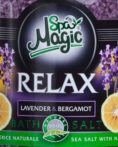 Close-up of the Relax label: lavender sprigs and halved bergamot either side of the name